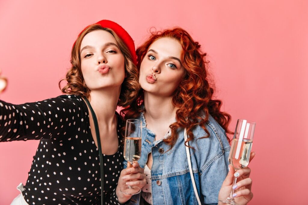 two-girls-taking-selfie-with-wineglasses-studio-shot-friends-drinking-champagne-pink-background_197531-17425-1024x683.jpg?x17654